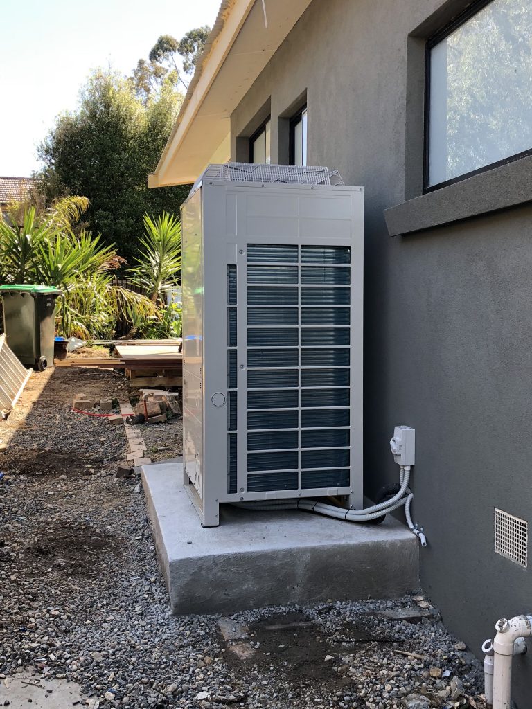 Daikin Ducted unit with Black floor return air grille outdoor unit cropped -